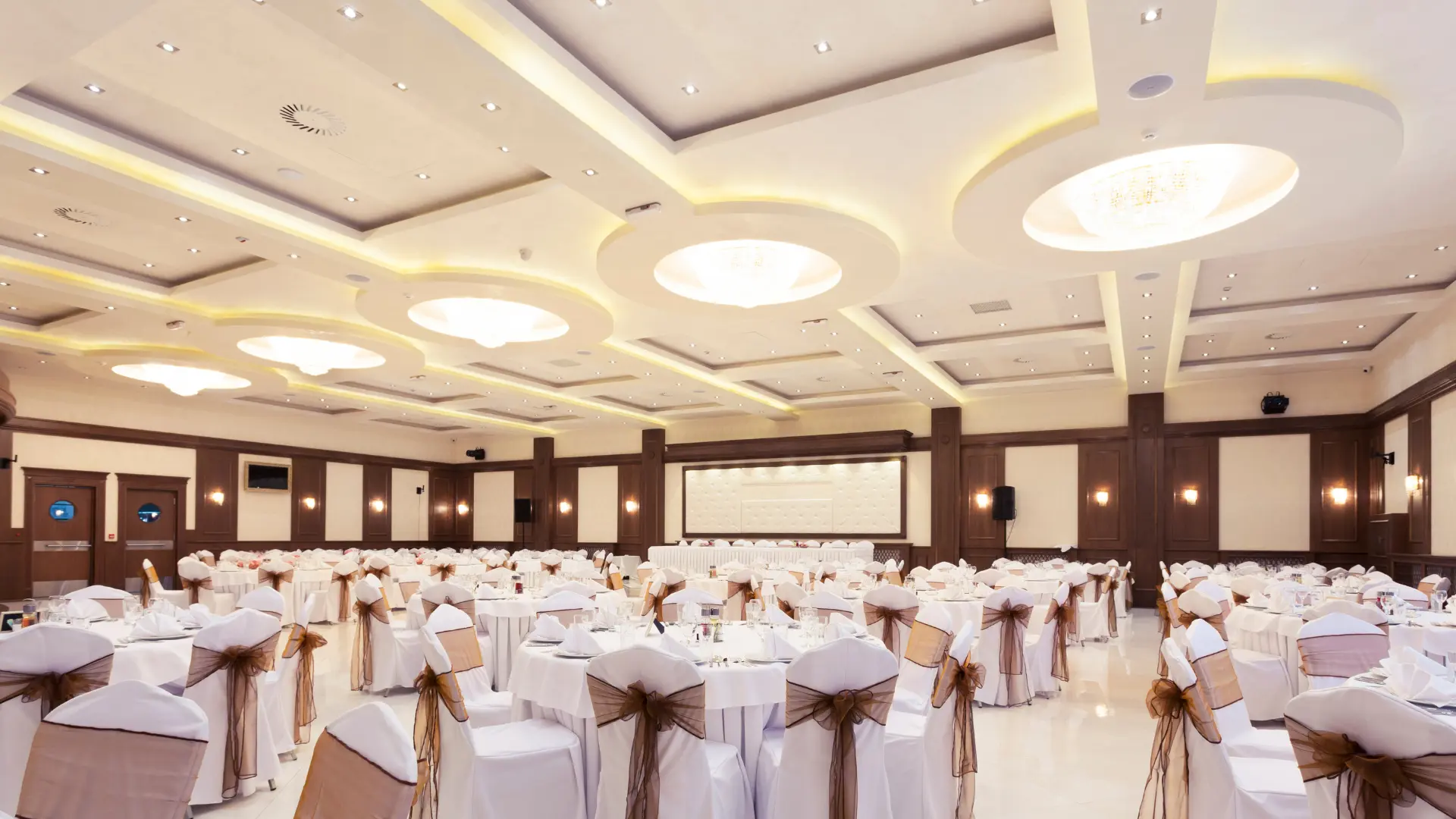 Modern banquet dining hall with elegant ceiling lights