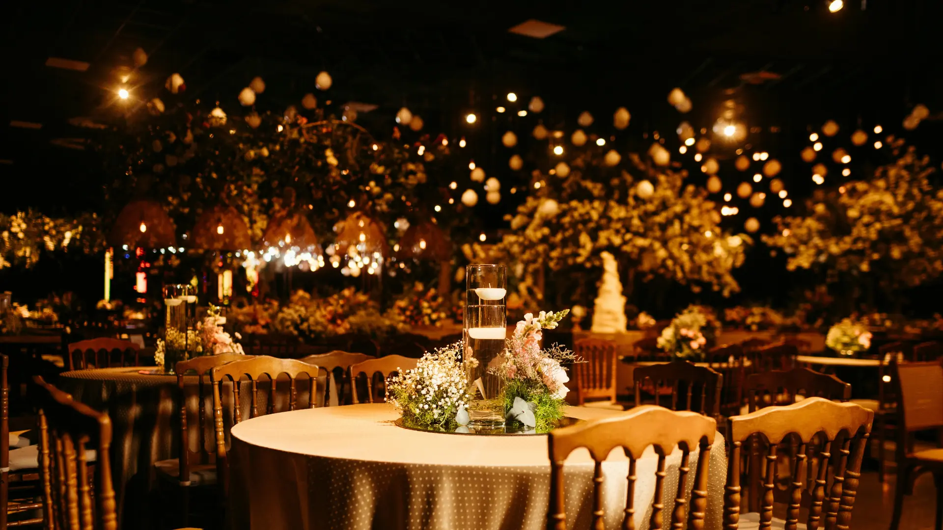 Warm-toned banquet dining scene with candlelit tables